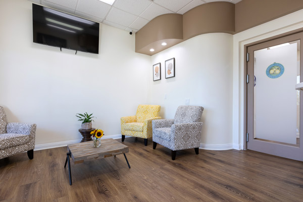 Waiting area with chairs and doorway at Higher Ground Dentistry in Upland, CA