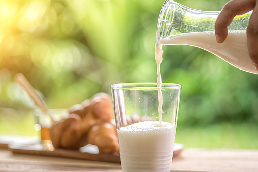 Pouring of milk into a glass