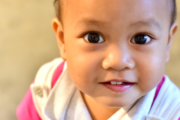 Close-up image of a baby with teeth.