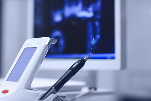 laser dental tool and monitor in dental office setting