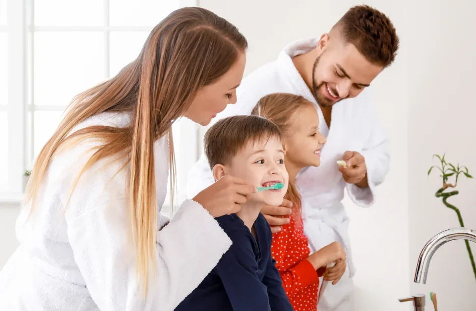 Family dental health tooth enamel protection with Upland dentist examining child's cavity prevention