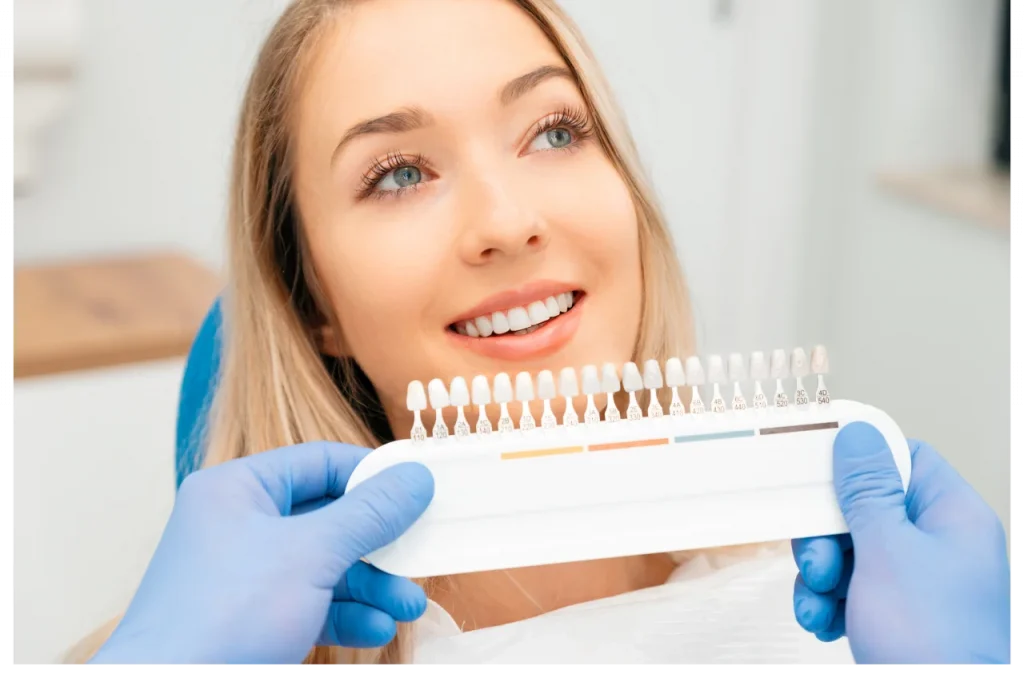 Happy patient showing beautiful smile with porcelain veneers at Higher Ground Dentistry Upland CA