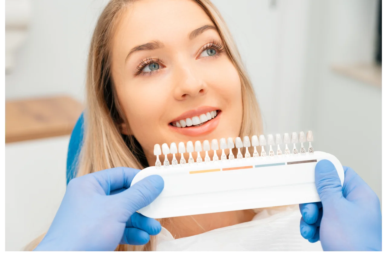 Happy patient showing beautiful smile with porcelain veneers at Higher Ground Dentistry Upland CA
