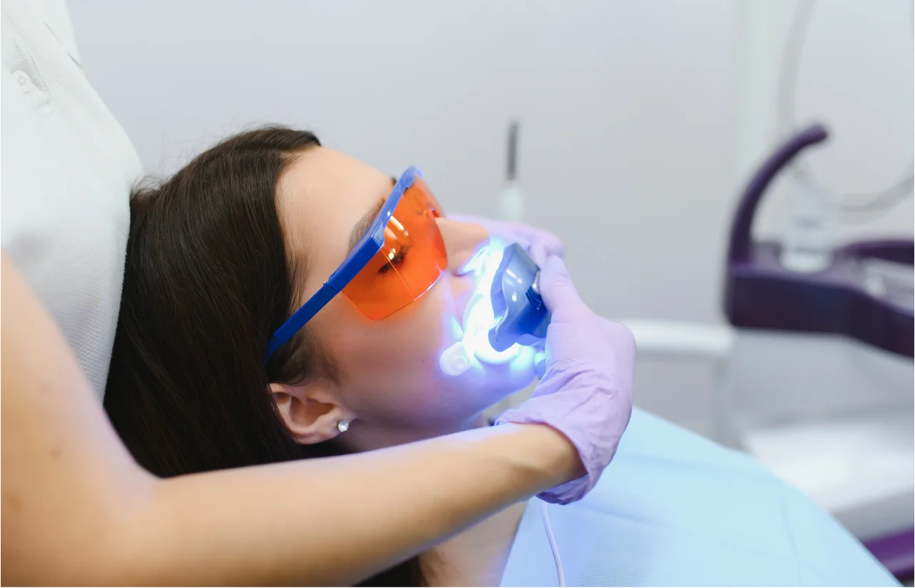 Patient receiving professional teeth whitening treatment at Higher Ground Dentistry Upland CA