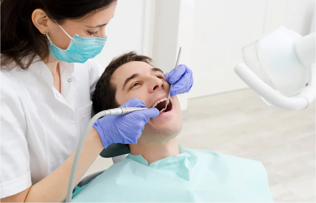 Dentist Upland CA performing professional dental checkup for New Year smile renewal
