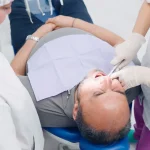 Dr. Sikka explaining wisdom tooth extraction to a patient at Higher Ground Dentistry in Upland CA