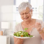 Patient practicing good dental implant care habits at home