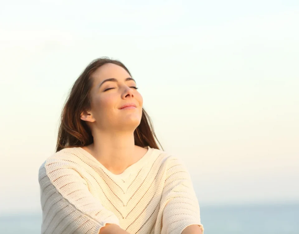 Woman breathing fresh air confidently representing halitosis treatment upland and oral health upland at Higher Ground Dentistry family dentistry upland ca